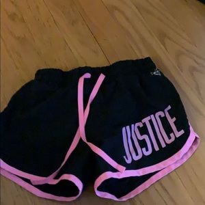 black and pink athletic shorts